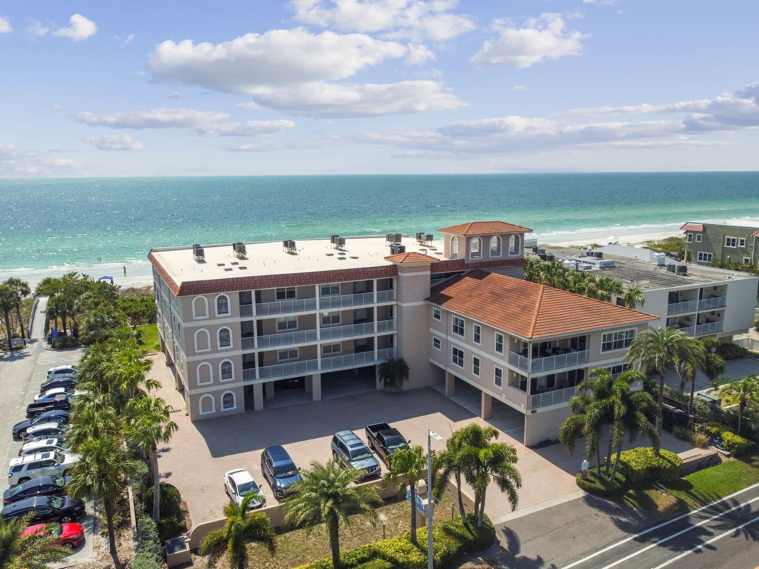 Aerial view of the Oceanside building at BeachInnIt with the Gulf of Mexico and Indian Rocks Beach behind it