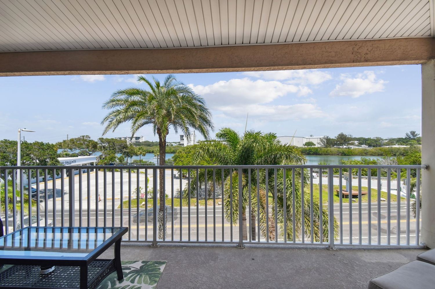 The view from the covered balcony over the palms to the intracoastal waterway