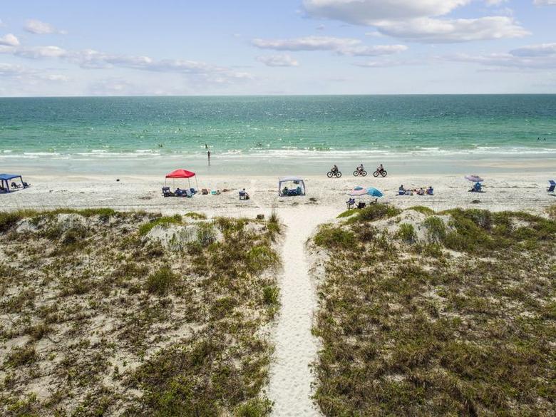 Aerial view of the private sand path running from the building through the dunes to the beach