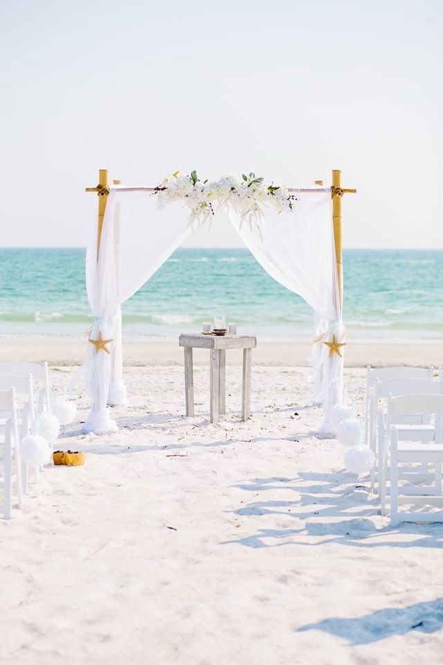 A wedding arch set up on the sand at Indian Rocks Beach