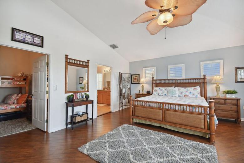 Primary bedroom with a king bed, daybed and en-suite bathroom